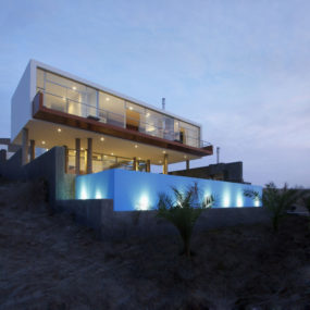 Rectangular Beach House with Floating Glazed Upper Floor